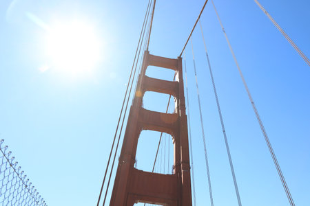 bright red column of Golden Gate Bridge against blue sky.の写真素材