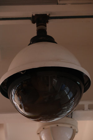 Surveillance cameras and a loudspeaker on the bulkhead of the ship's hull.