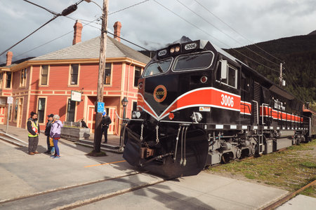 White Pass & Yukon Route locomotive 3005 (2020) hauling a tourist train, approaching Skagway,...