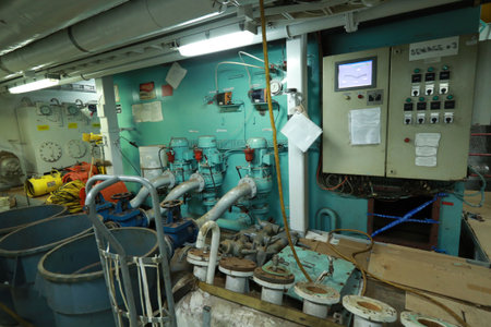 Cruise ship engine room interior with water tight doors electrical and diesel engines, water pipes,...