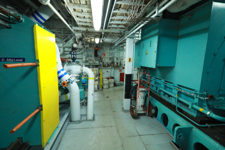Cruise ship engine room interior with water tight doors electrical and diesel engines, water pipes, measuring instruments, diesel enginesの写真素材