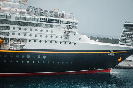NASSAU, BAHAMAS - MARCH 25, 2026: The iconic bow of the Disney Magic cruise liner docked alongside the MSC Divina passenger ship at the Nassau Cruise Port terminal during a Caribbean cruise itinerary.