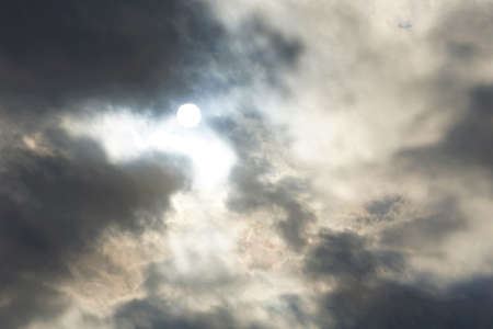 Sun Passing Through Heavy Cloudsの写真素材