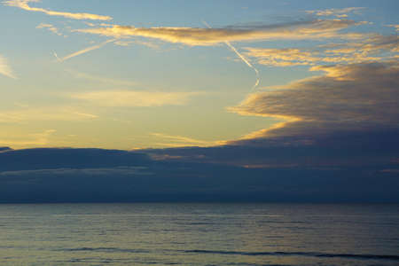 Tinge of Sun in a Cloudy Sky at Duskの写真素材