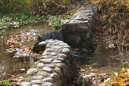 Stone Wall with Small Waterfallの写真素材