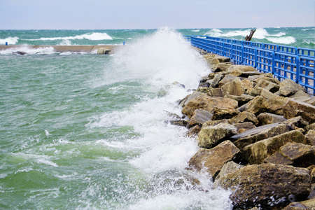 Waves Crash the Pierの写真素材