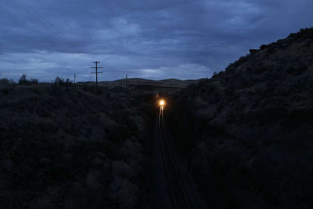 train at night, rocks and nature