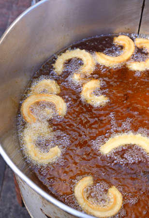 Churros in oil, fried churros, sweets