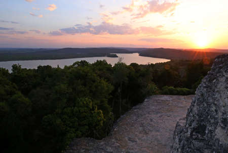 Sunset at over Yaxha, Maya Ruins in Guatemalaの写真素材