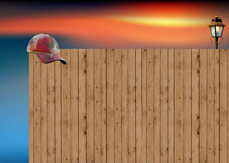 Wood with hat and street light on the sunrise backgroundの写真素材