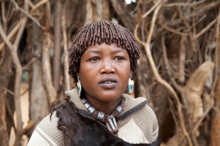 Key Afar, Ethiopia, Febrauary 14, 2013: african woman of the Banna ethnic group with tribal hair style is wearing the necklace that mean She is the first wifeのeditorial素材