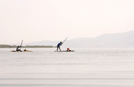 Arba Minch, Ethiopia, February 21, 2013: african fishermen with traditional boat is going to fish on the lake Chamo.のeditorial素材