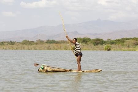 Arba Minch, Ethiopia, February 21, 2013: african fishermen with traditional boat is going to fish on the lake Chamo.のeditorial素材