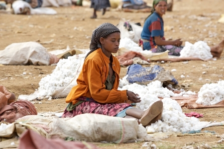 Dorze village, Ethiopia, February 21, 2013: african woman of the Dorze ethnic group are selling cotton at the Dorze village market.のeditorial素材