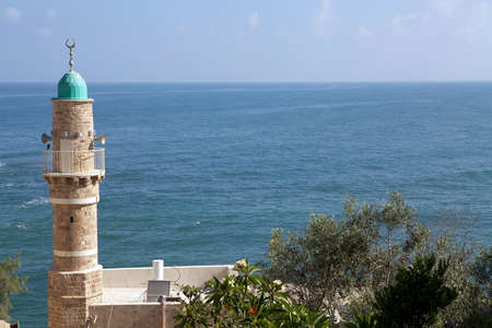 Mosque minaret and seascape の写真素材