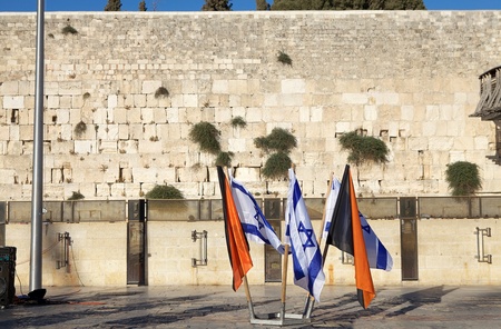 Israeli flags and army flags are waving at the Western Wall in the Jerusalem old town, Jerusalem,...