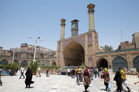 Iranian peole are walking in the courtyard of the Imam Khomeini Mosque. The mosque is inside the bazaar and it is one of the largest and busiest in Tehran, Iranのeditorial素材