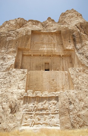 The tomb of Darius I the Great and below the relief of equestrian victory of Bahram II over enemy at...
