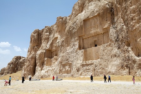Tourists at the Naqsh-e Rustam, Iran  Naqsh-e Rustam is an ancient necropolis located about 12 kilometres of Persepolis and few hundreds meter from Naqsh-e Rajab  The oldest relief dates to 1000 BC  Four tombs of Achaemenid kings are carved out of the rocのeditorial素材