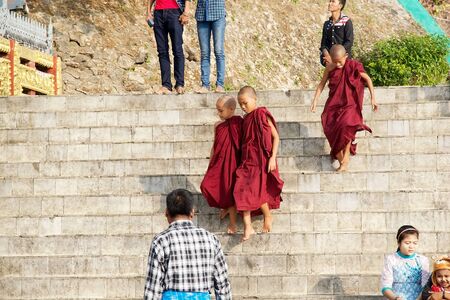 Young Buddhist monks at the site Kyaiktiyo Pagoda Golden Rock Kyaiktiyo Myanmar or Burma. Kyaiktiyo Pagoda anche known as Golden Rock is a well known Buddhist pilgrimage site in the Mon State Myanmar.のeditorial素材