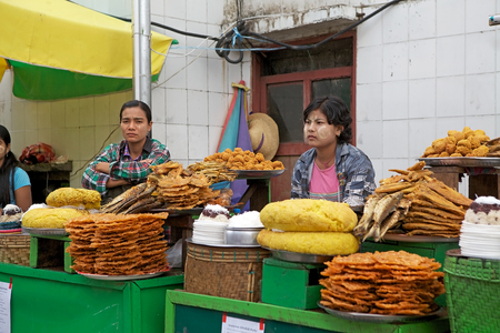 Street food vendors along the street near the Golden Rock Pagoda Kyaiktiyo Kyaiktiyo Myanmar or Burma. Kyaiktiyo Pagoda anche known as Golden Rock is a well known Buddhist pilgrimage site in the Mon State Myanmar.のeditorial素材