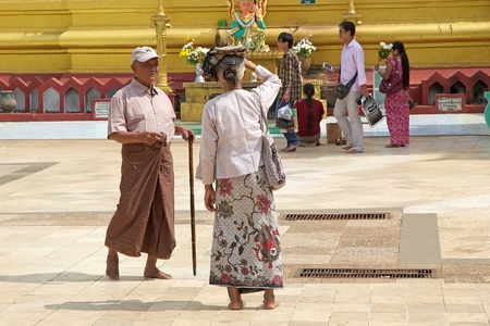Pilgrims are visiting the Shwemawdaw Paya, Bago, Myanmar. Shwemawdaw Paya is a stupa located in Bago, Myanmar. It is often referred to as the Golden God Temple. At 114 m in height, it is the tallest pagoda in Myanmar. The Shwemawdaw Paya was built around のeditorial素材