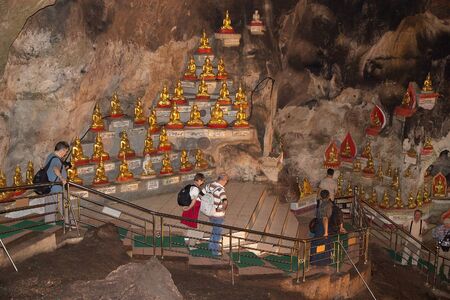 Tourists are visiting the Pindaya Caves Pindaya Myanmar or Burma. Pindaya Caves are a Buddhist pilgrimage site and a tourist attraction. The limeston caves have almost 8000 Buddha images and most of them are gold.のeditorial素材