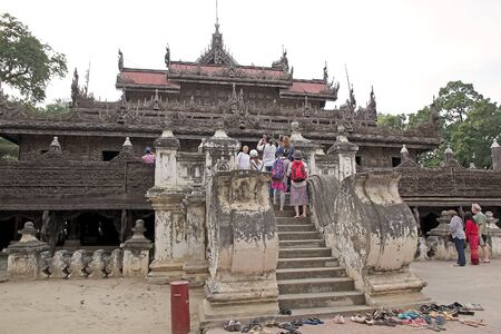 tourists are visiting the Shwe Nandaw Kyaung Monastery, Mandalay, Myanmar. のeditorial素材