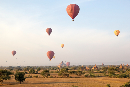 Hot air balloons over the ruins of Bagan, Bagan, Myanmar, with the Dhammayangyi temple in the background. のeditorial素材