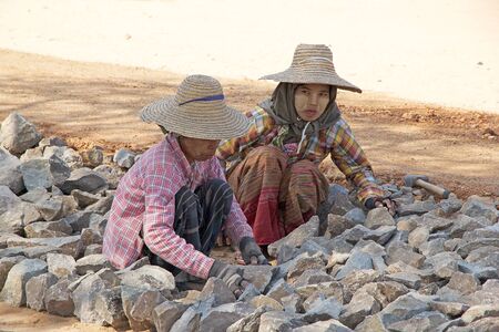 Burmese women are working to build a road in the Bagan archaeological site, Bagan, Myanmarのeditorial素材