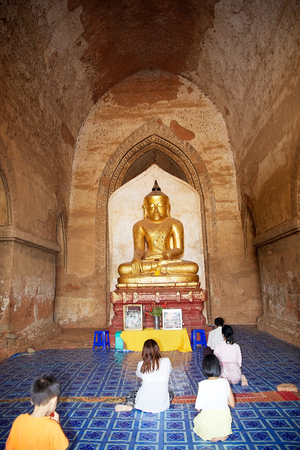 Burmese pilgrims are praying in the Dhammayangyi temple,Bagan, Myanmar. Largest of all temples in Bagan, it was built during the reign of King Narathu, who came to the throne by assassinating his father and his elder brother.のeditorial素材