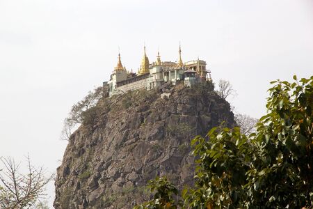The monastery on the top of Mount Popa, Myanmar. Taung Kalat pedestrian hill is called Mount Popa. At one time, the Buddhist hermit U Khandi manteined the stairway of 777 steps to the summit of the Taung Kalatの写真素材