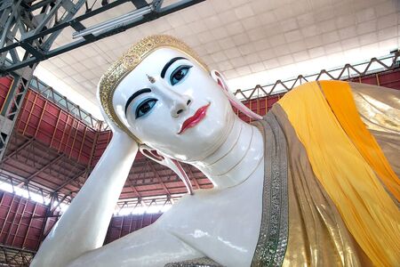 The giant reclining Buddha at the Chaukhtatgyi Buddha Temple, Yangon, Myanmar. The temple houses one of the most revered reclining Buddha in the Country. The Buddha image was 66 metres long and one of the largest in Myanmar. The construction began in 1899のeditorial素材