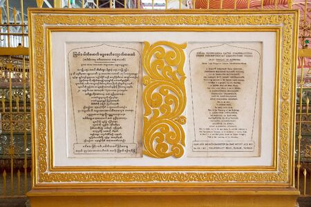 The stone inscription of exhortation verses at the Chaukhtatgyi Buddha Temple, Yangon, Myanmar. The temple houses one of the most revered reclining Buddha in the Country. The Buddha image was 66 metres long and one of the largest in Myanmar. The constructのeditorial素材