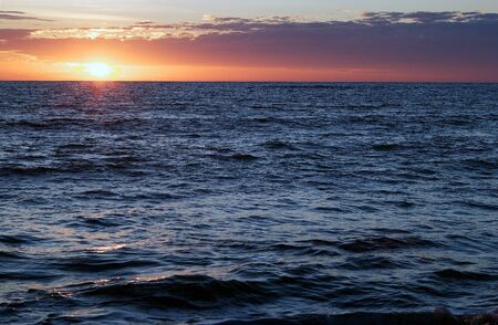 Dramatic cloudscape in the sky at sunset over the sea