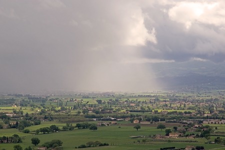Panorama of the plain of Assisi, Italy. Assisi is a town in Province of Perugia in Umbria Region, on the western flank of Monte Subasio. It was the birthplace of St. Francis, who founded the Franciscan religious order in the town in 1208 and St. Clare, thの写真素材