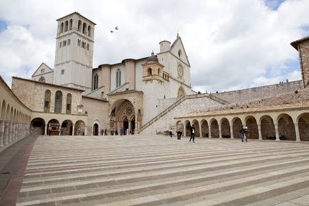Pilgrims and tourists are visiting the Basilica of San Francesco d'Assisi, upper church, in Assisi, Italy. Assisi is a town in Province of Perugia in Umbria Region, on the western flank of Monte Subasio. It was the birthplace of St. Francis, who founded tのeditorial素材
