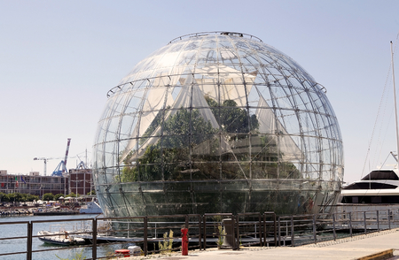 The Biosphere at the old harbour of genoa, Italy. The Biosphere is a scenic structure near the Aquarium designed in 2001 by architect Renzo Piano. It is a step into a tropical rainforest and it is home to over 150 animal and plant species.のeditorial素材