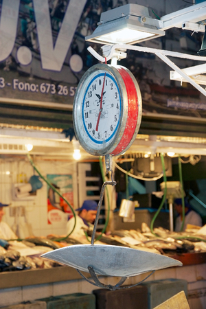 Steelyard balance at the fish market in the Mercado Central at the Santiago de Chile, Chile. The Mercado Central was opened in 1872 and it is the central market of santiago de Chileのeditorial素材
