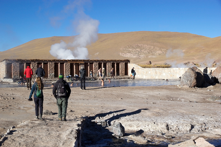 Tourists are taking a bath in a natural swimming pool at the El Tatio geysers, Chile. El Tatio is a geyser field located in the northern Chile. It is the largest geyser field in the southern hemisphere and the third geyser field in the world.のeditorial素材