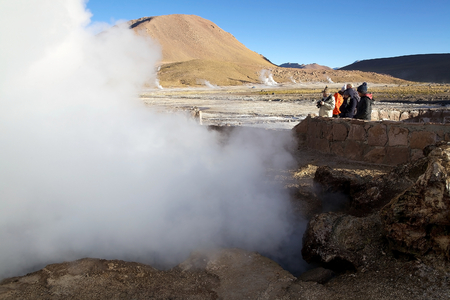 Tourists are visiting the El Tatio geysers, Chile. El Tatio is a geyser field located in the northern Chile. It is the largest geyser field in the southern hemisphere and the third geyser field in the world.のeditorial素材