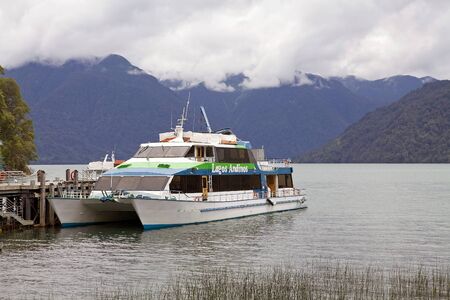Catamaran passenger ferry on the Todos Los Santos Lake landscape, Chile. The lake is located in the...