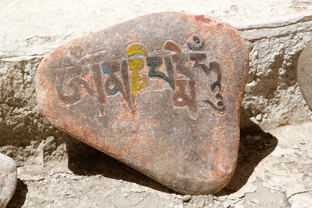 Mani stone at the Stok Palace in Ladakh, India. Mani stone, inscribed with a mantra,  is a form of prayer in Tibetan Buddhismの写真素材