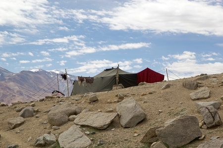 Nomad tent along the shore of Tso Moriri Lake In Ladakh region in the Indian state of Jammu and Kashmir. The mountain lake is at an altitude of 4522 m in the Changthang Plateauの写真素材