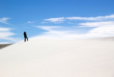 White dune at the lava field of the volcano Caraci Pampa at the Puna de Atacama, Argentina. Puna de Atacama is an arid high plateau in the Andes of northern Chile and Argentina. In Argentina Puna's territory is extended in the provinces of Salta, Jujuy and Catamarcaの写真素材