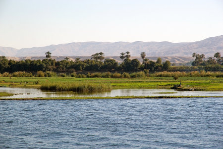 Landscape along the Nile river between Luxor and Aswan, Egypt. Landscape and fishermanの写真素材