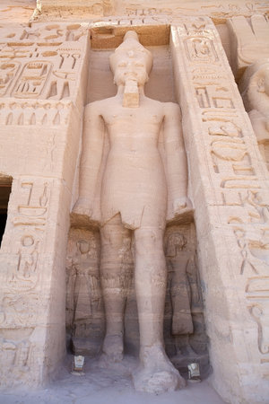 Statue on the facade of the Small Temple of Hathor and Nefertari in the village of Abu Simbel. Abu...