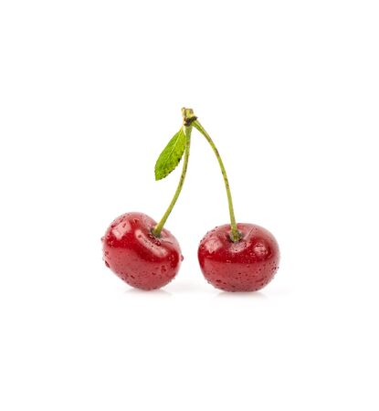 Cherry with leaf isolated on whiteの写真素材