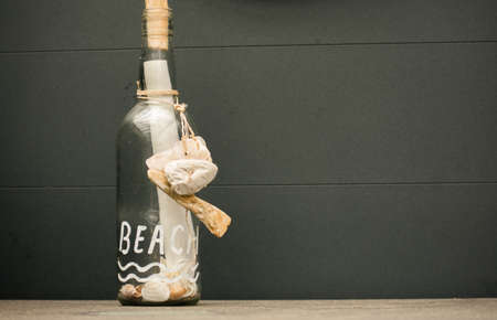 Message In A Bottle Glass Summer Paper Beach Vibe Shells Gray Backgroundの写真素材