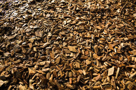 A floor of wooden flakes in a playground which can be used as a cool background.